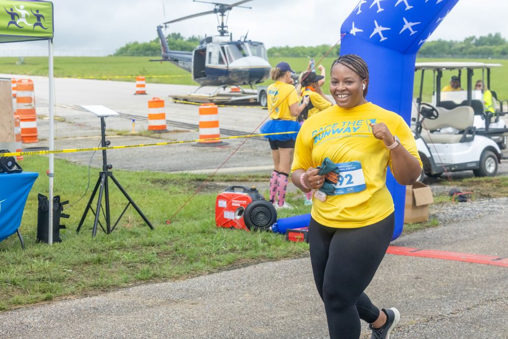runner crosses the finish line