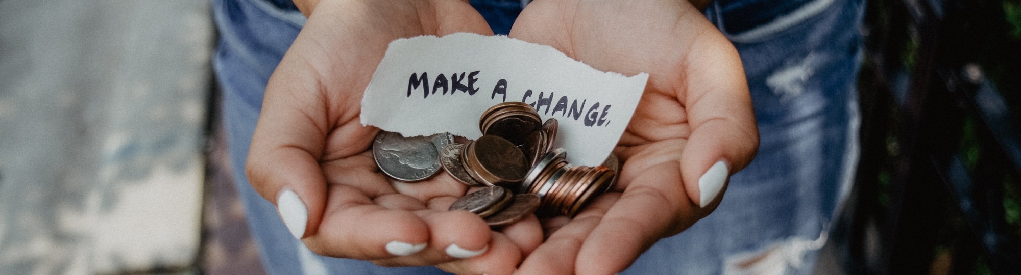 hands holding coins to give to United Way